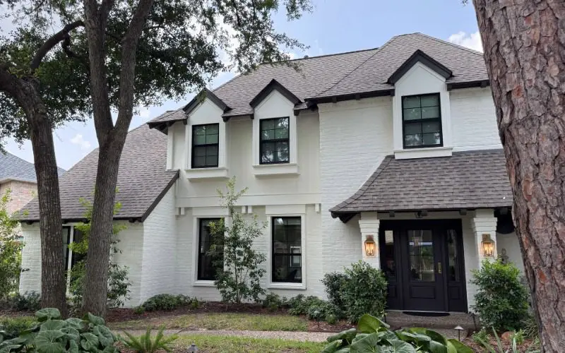 Houston, Texas home repainted, replacement windows and entry door done by Allied Exteriors.