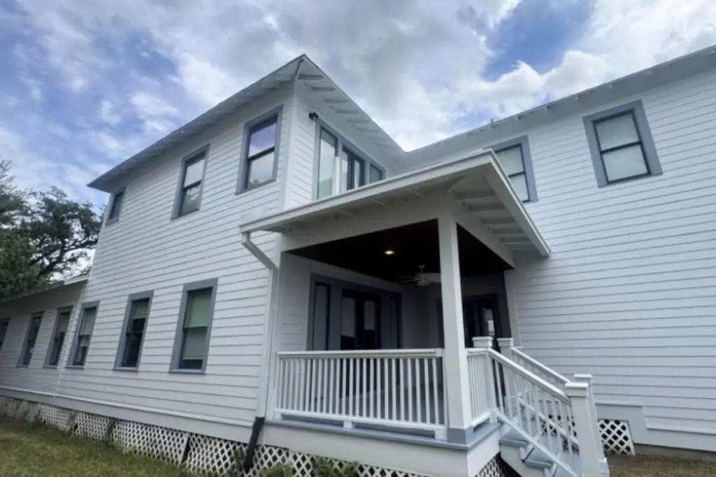 Two-story Houston home with light gray Hardie siding and white trim