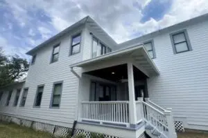 Two-story Houston home with light gray Hardie siding and white trim
