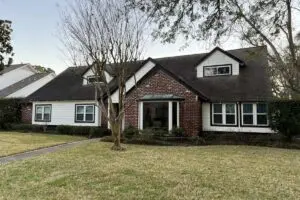 Houston, TX brick and white siding home with replacement windows