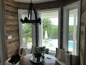 Looking through a bay window behind a kitchen table