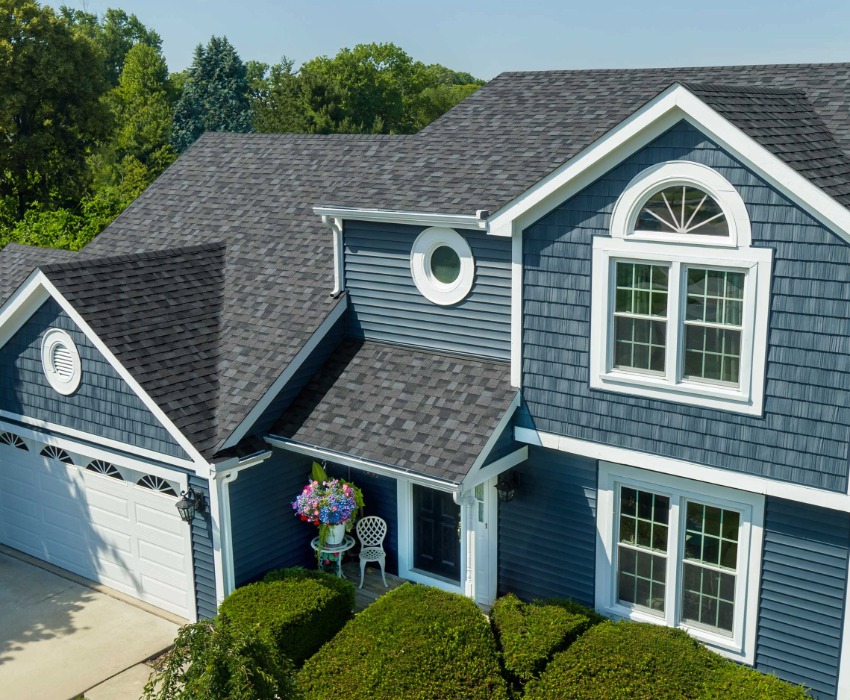 Owens Corning roof replacement on a blue home