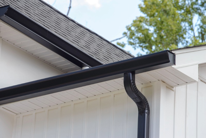 Seamless black gutter on a white home