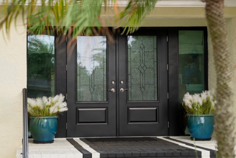 Black steel double entry door with decorative glass