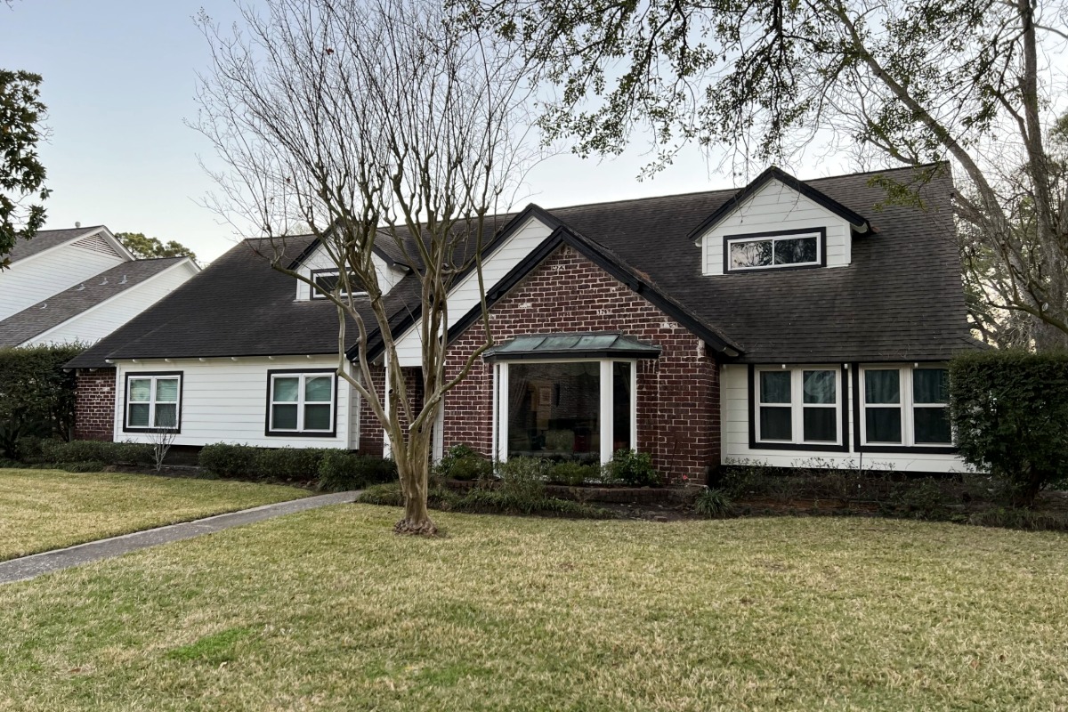 Hhouston, TX brick and white siding home with replacement windows