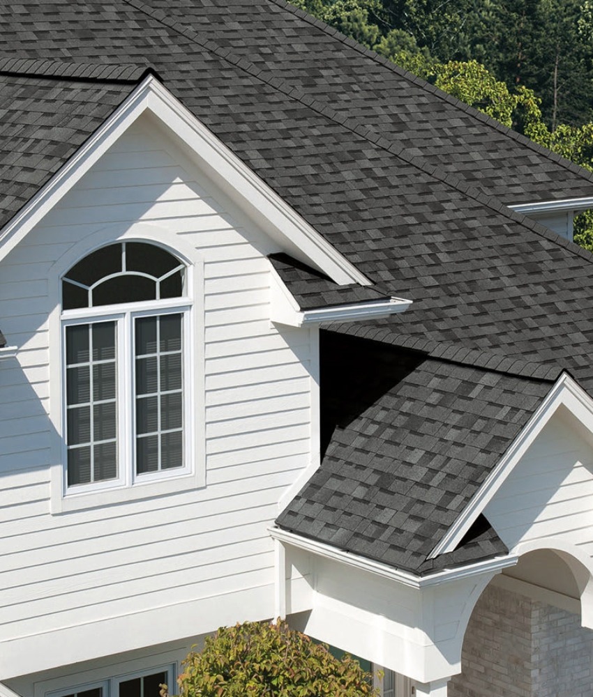 Owens Corning shingles in Estate Grey on a white home