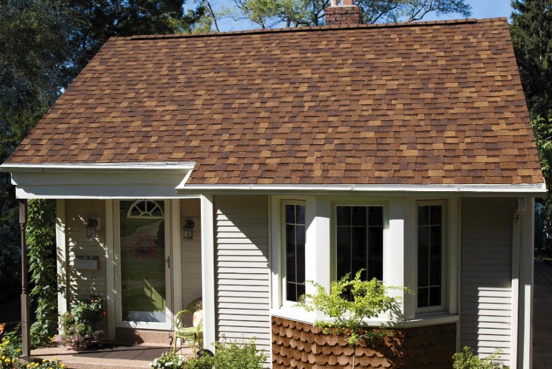 Owens Corning simple roof with brown shingles on a tan home