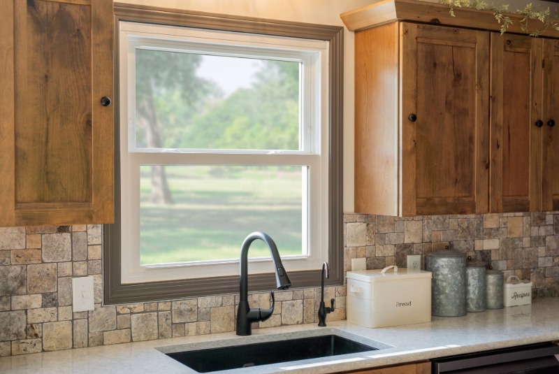 White double hung window in a kitchen over a sink