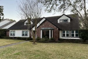 Houston, TX brick and white siding home with replacement windows