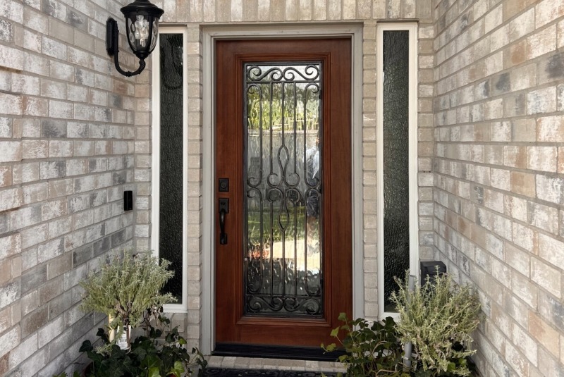 Houston fiberglass entry door with wrought iron by Allied Exteriors.